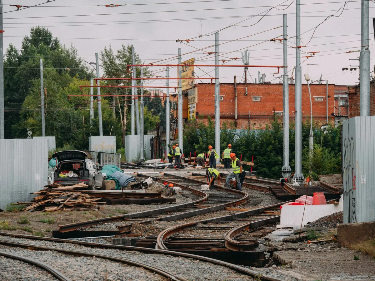 A construction crew working on railway tracks
